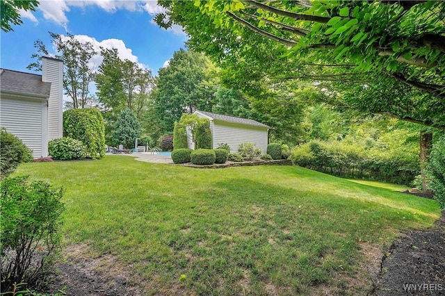 57 Middlebury Rd, Orchard Park, NY 14127 - view of green lawn featuring an outbuilding