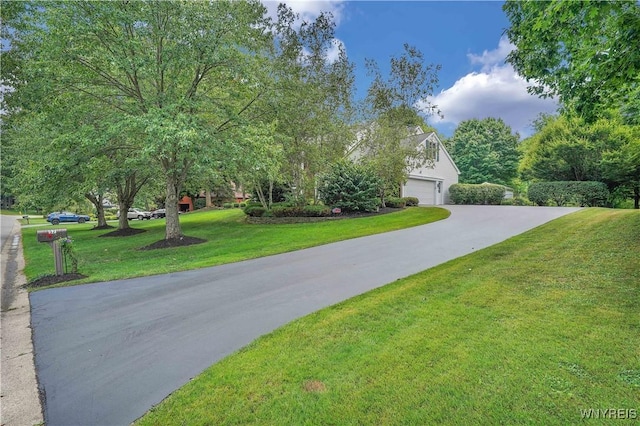 57 Middlebury Rd, Orchard Park, NY 14127 - view of front facade featuring concrete driveway and a front lawn