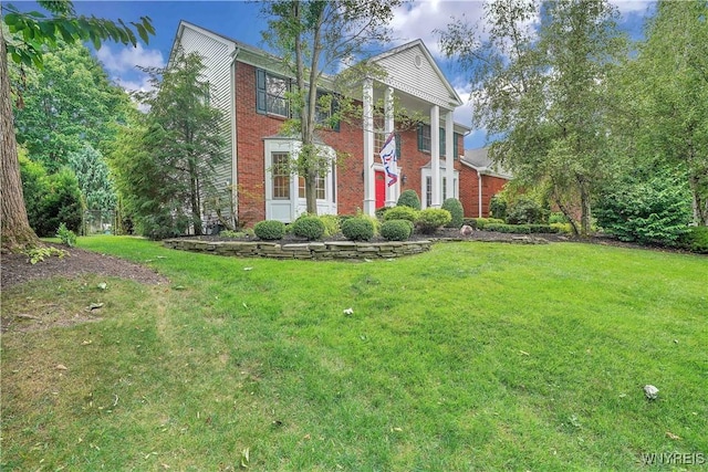57 Middlebury Rd, Orchard Park, NY 14127 - greek revival inspired property featuring brick siding and a front lawn