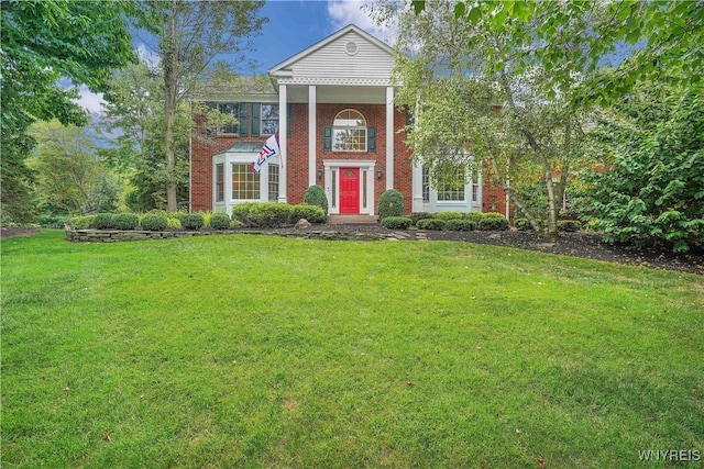 57 Middlebury Rd, Orchard Park, NY 14127 - greek revival inspired property with a front lawn and brick siding