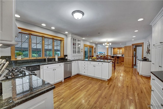 57 Middlebury Rd, Orchard Park, NY 14127 - kitchen with stainless steel dishwasher, a peninsula, recessed lighting, light wood-style floors, and white cabinets