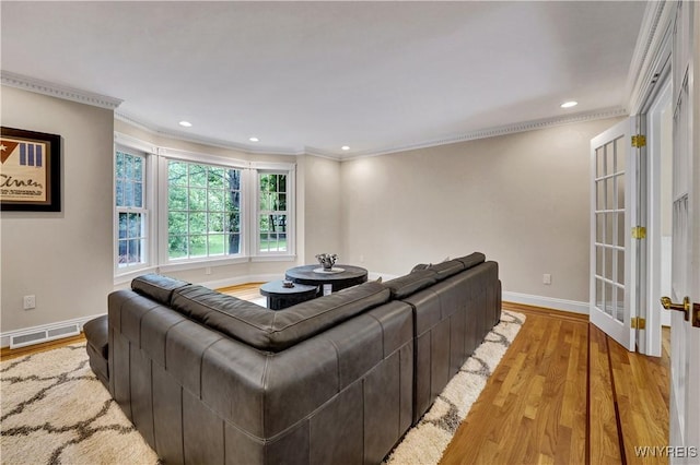 57 Middlebury Rd, Orchard Park, NY 14127 - living room with ornamental molding, light wood finished floors, recessed lighting, and french doors
