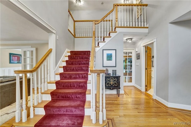 57 Middlebury Rd, Orchard Park, NY 14127 - staircase featuring wood finished floors and a high ceiling