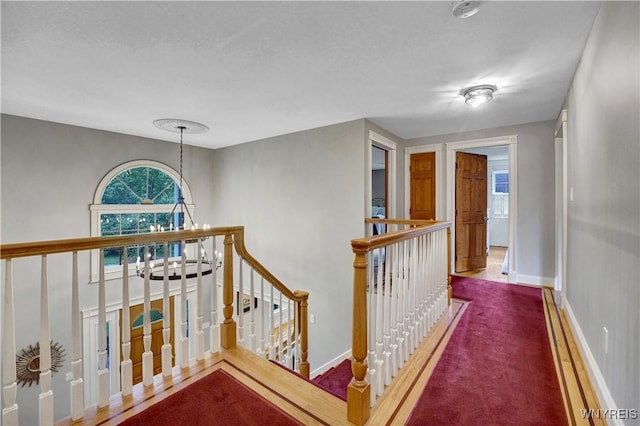 57 Middlebury Rd, Orchard Park, NY 14127 - hallway with an upstairs landing and a chandelier