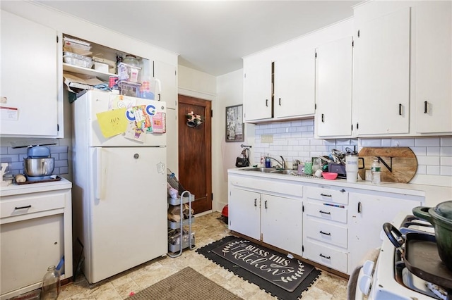 147 Springfield Ave, Rochester, NY 14609 - kitchen with white appliances, light countertops, tasteful backsplash, and white cabinets