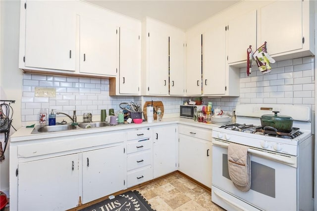 147 Springfield Ave, Rochester, NY 14609 - kitchen featuring white gas range oven, light countertops, tasteful backsplash, and white cabinets