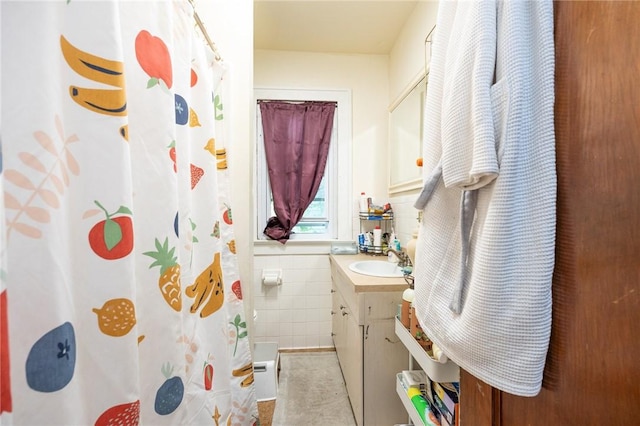 147 Springfield Ave, Rochester, NY 14609 - full bathroom featuring vanity, tile walls, and a shower with curtain
