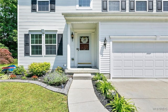 111 Aegean Ave, Amherst, NY 14228 - property entrance with an attached garage and driveway