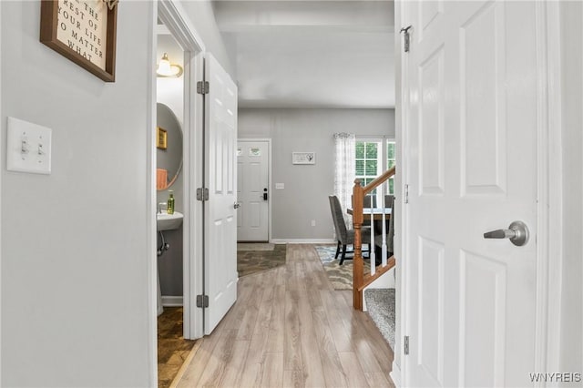 111 Aegean Ave, Amherst, NY 14228 - hallway featuring light wood finished floors and baseboards