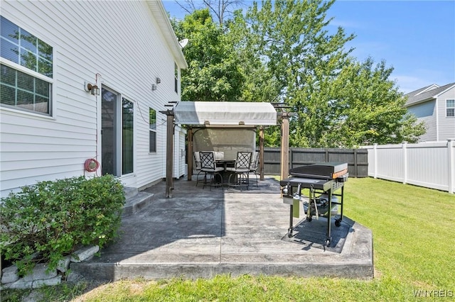 111 Aegean Ave, Amherst, NY 14228 - fenced backyard with outdoor dining area and a grill