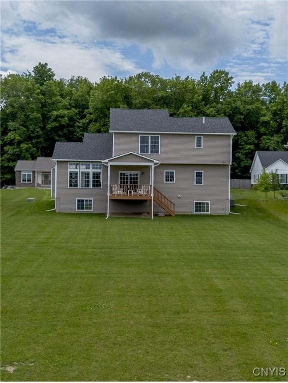 3427 Tall Tree Ln, Lysander, NY 13027 - back of property with a wooden deck, a yard, and stairway