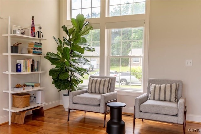 3427 Tall Tree Ln, Lysander, NY 13027 - living area with baseboards and wood finished floors