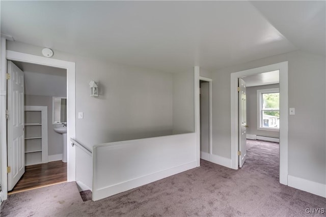 713 Parham St, Wilna, NY 13619 - carpeted empty room featuring baseboard heating and a smoke detector