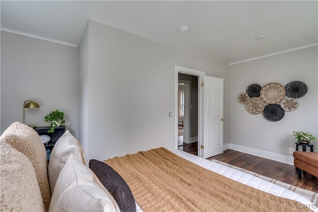 713 Parham St, Wilna, NY 13619 - bedroom with crown molding and dark wood-style flooring