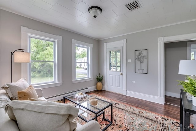 713 Parham St, Wilna, NY 13619 - living room featuring baseboard heating, wood finished floors, and crown molding