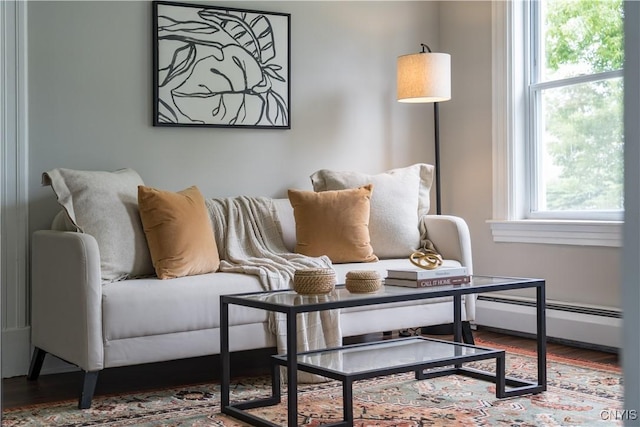 713 Parham St, Wilna, NY 13619 - living area featuring baseboard heating and wood finished floors