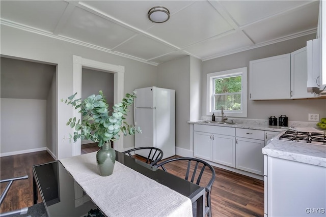 713 Parham St, Wilna, NY 13619 - kitchen with freestanding refrigerator, white cabinets, dark wood finished floors, and light stone counters