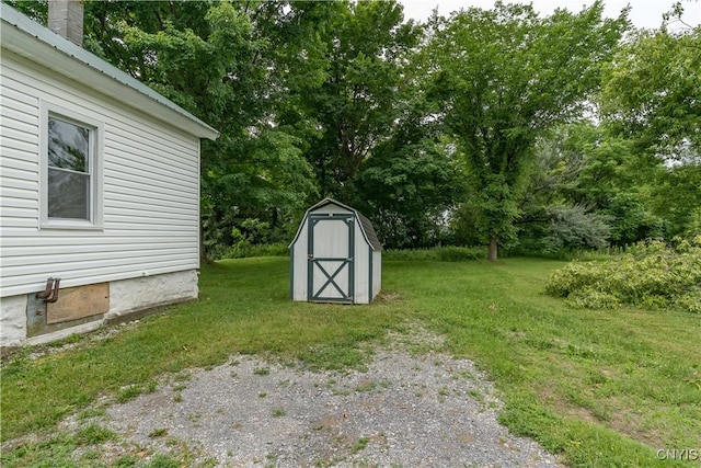 713 Parham St, Wilna, NY 13619 - view of green lawn featuring a shed and view of scattered trees