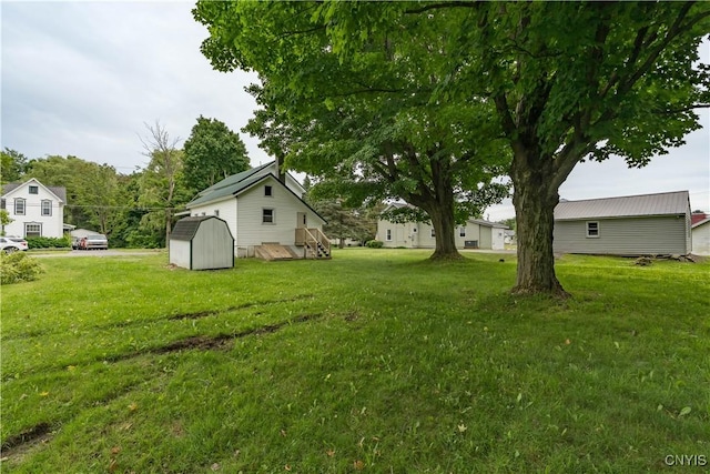 713 Parham St, Wilna, NY 13619 - view of grassy yard featuring a storage unit