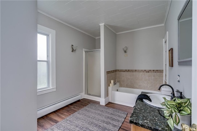 713 Parham St, Wilna, NY 13619 - bathroom featuring a baseboard heating unit, a bath, a stall shower, ornamental molding, and wood finished floors