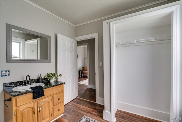 713 Parham St, Wilna, NY 13619 - bathroom with vanity, wood finished floors, and ornamental molding