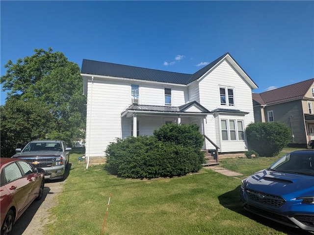 10 Mcclellan Ave, Mount Jewett Boro, PA 16740 - traditional home featuring a metal roof and a front lawn