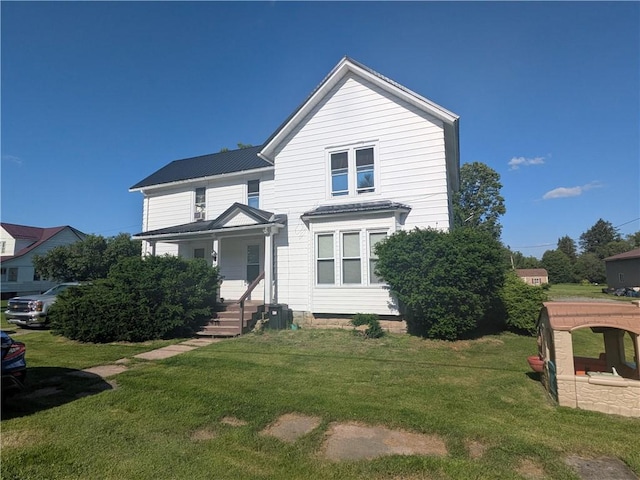 10 Mcclellan Ave, Mount Jewett Boro, PA 16740 - traditional-style house featuring a front yard, a metal roof, and covered porch