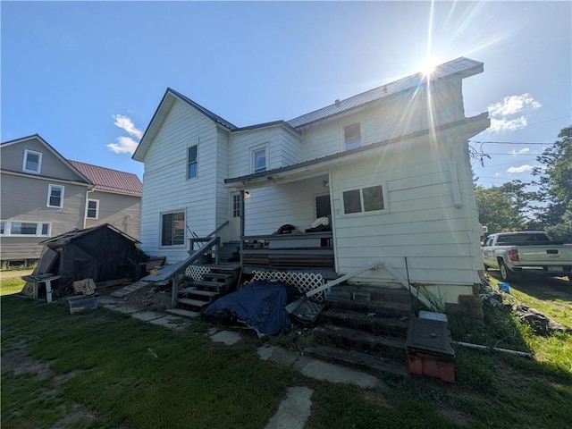 10 Mcclellan Ave, Mount Jewett Boro, PA 16740 - rear view of property featuring a wooden deck and a lawn