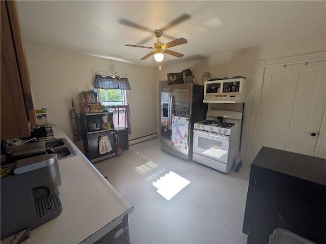 10 Mcclellan Ave, Mount Jewett Boro, PA 16740 - kitchen featuring gas range gas stove, stainless steel fridge with ice dispenser, ceiling fan, a baseboard heating unit, and light floors