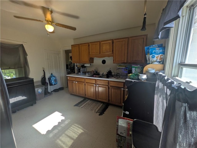 10 Mcclellan Ave, Mount Jewett Boro, PA 16740 - kitchen with brown cabinets, light countertops, and a ceiling fan