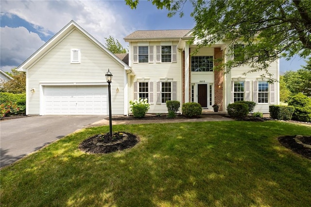 6915 Proximity Ln, Victor, NY 14564 - view of front facade featuring driveway, a front yard, and an attached garage