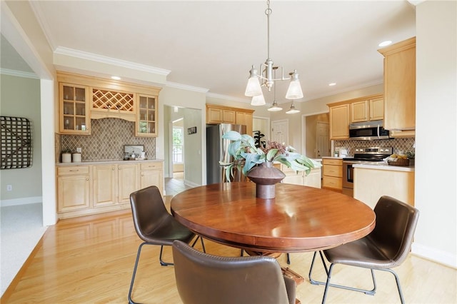 6915 Proximity Ln, Victor, NY 14564 - dining room with ornamental molding, light wood-style floors, and a chandelier