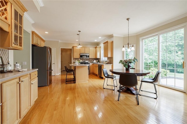 6915 Proximity Ln, Victor, NY 14564 - dining area featuring light wood-type flooring, a chandelier, ornamental molding, and recessed lighting