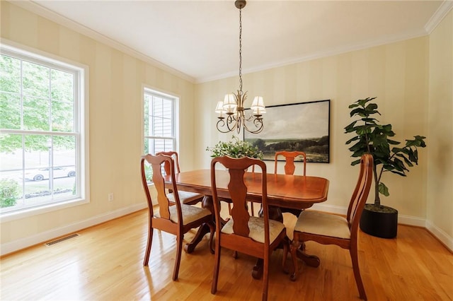 6915 Proximity Ln, Victor, NY 14564 - dining space featuring ornamental molding, light wood-type flooring, and a chandelier