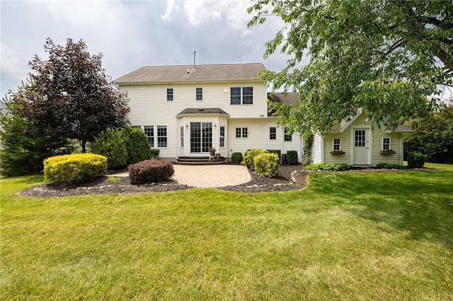 6915 Proximity Ln, Victor, NY 14564 - back of property featuring a lawn and a patio area