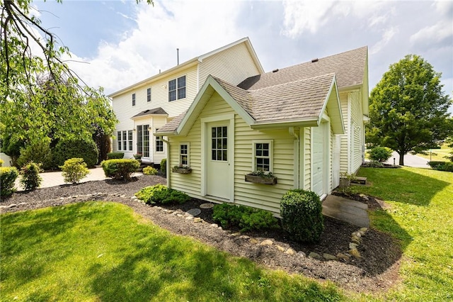 6915 Proximity Ln, Victor, NY 14564 - back of house with a lawn and a shingled roof