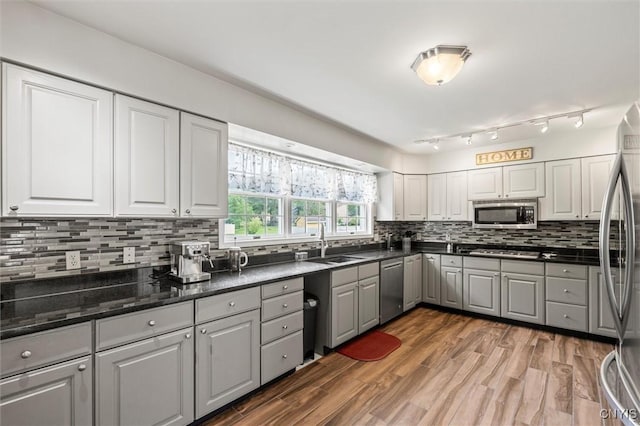 331 Hickory Ln, Hastings, NY 13036 - kitchen featuring appliances with stainless steel finishes, gray cabinets, decorative backsplash, light wood finished floors, and white cabinets