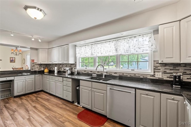 331 Hickory Ln, Hastings, NY 13036 - kitchen featuring dishwasher, dark countertops, decorative backsplash, and gray cabinetry