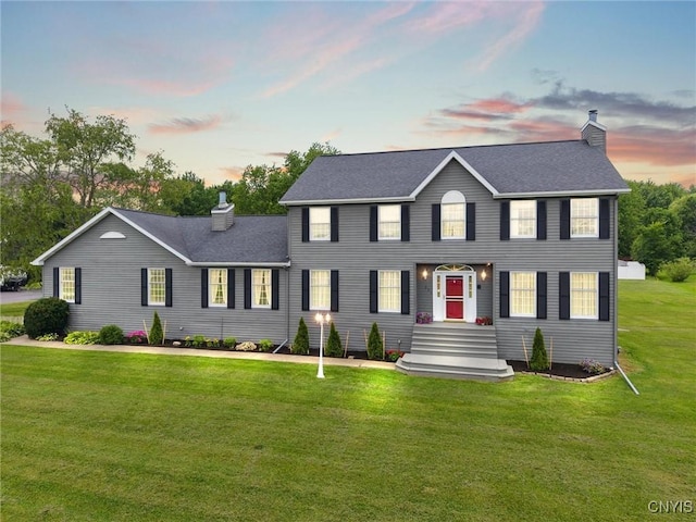 331 Hickory Ln, Hastings, NY 13036 - colonial-style house with a chimney, a lawn, and roof with shingles