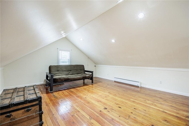 108 Iroquois St, Rochester, NY 14609 - living area featuring a baseboard heating unit, hardwood / wood-style flooring, and lofted ceiling
