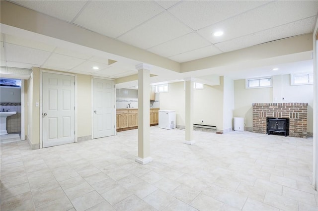 108 Iroquois St, Rochester, NY 14609 - below grade area with a baseboard radiator, a drop ceiling, and recessed lighting
