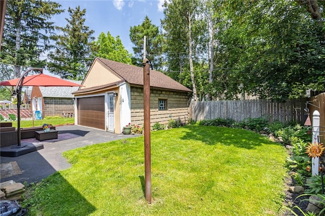 108 Iroquois St, Rochester, NY 14609 - view of yard featuring an outdoor structure and a garage