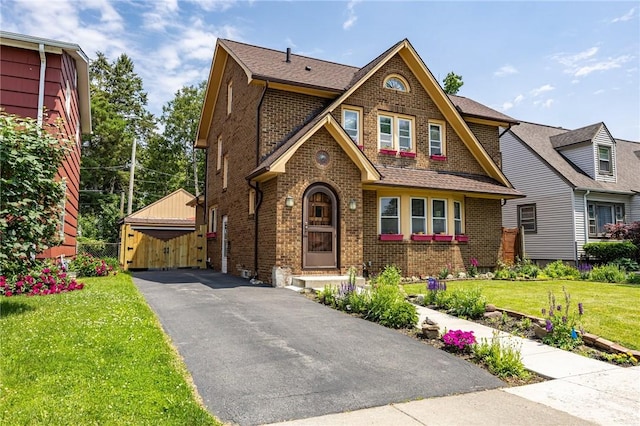 108 Iroquois St, Rochester, NY 14609 - view of front of property featuring brick siding, a front lawn, and a gate