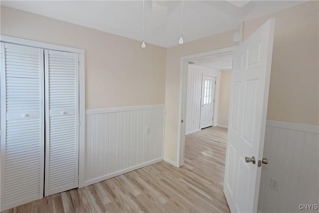 32 Franklin St, Champion, NY 13619 - hall featuring wainscoting and light wood-type flooring
