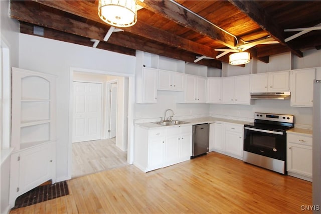 32 Franklin St, Champion, NY 13619 - kitchen featuring stainless steel appliances, a wooden ceiling with exposed beams, light countertops, light wood-style floors, and under cabinet range hood
