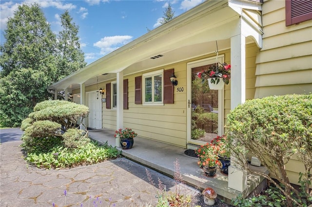 500 Watson Rd, Perinton, NY 14450 - view of exterior entry with a porch
