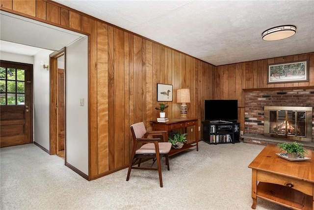 500 Watson Rd, Perinton, NY 14450 - living area featuring carpet floors, wooden walls, and a fireplace