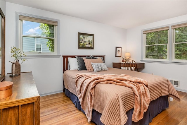 500 Watson Rd, Perinton, NY 14450 - bedroom with light wood-style flooring and multiple windows