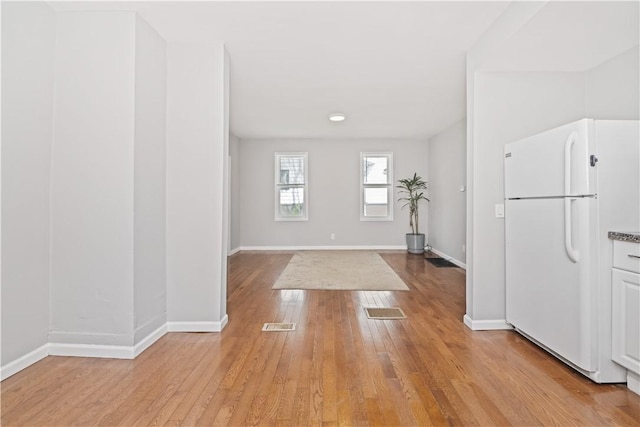 1084 Plymouth Ave S, Rochester, NY 14608 - entryway with light wood-style floors and baseboards