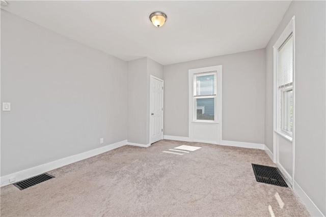 1084 Plymouth Ave S, Rochester, NY 14608 - carpeted spare room featuring baseboards